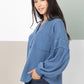 Raw Edge Knit Henley with Hooded Detail