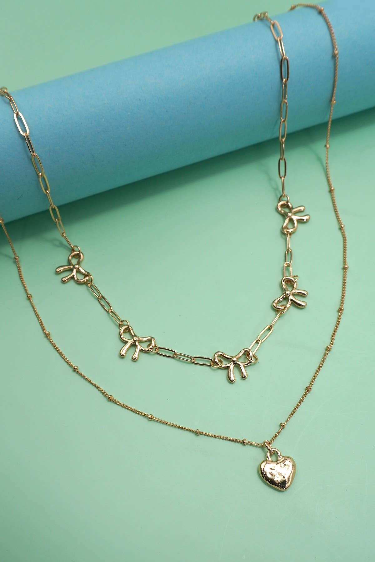 DOUBLE LAYER MULTI BOW WITH HEART CHARM NECKLACE | 80N91660