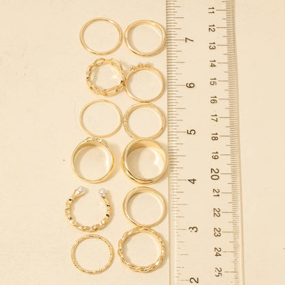 Twelve Piece Assorted Mother Of Pearl Heart Ring Set
