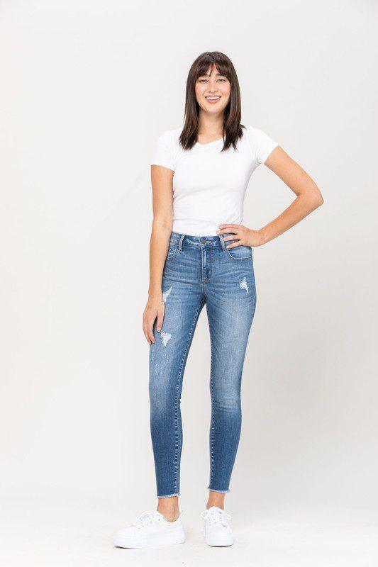 Image: Mid Rise Fray Hem Crop Skinny Denim with Distressed Detail. Denim | Southern Sassy Boutique